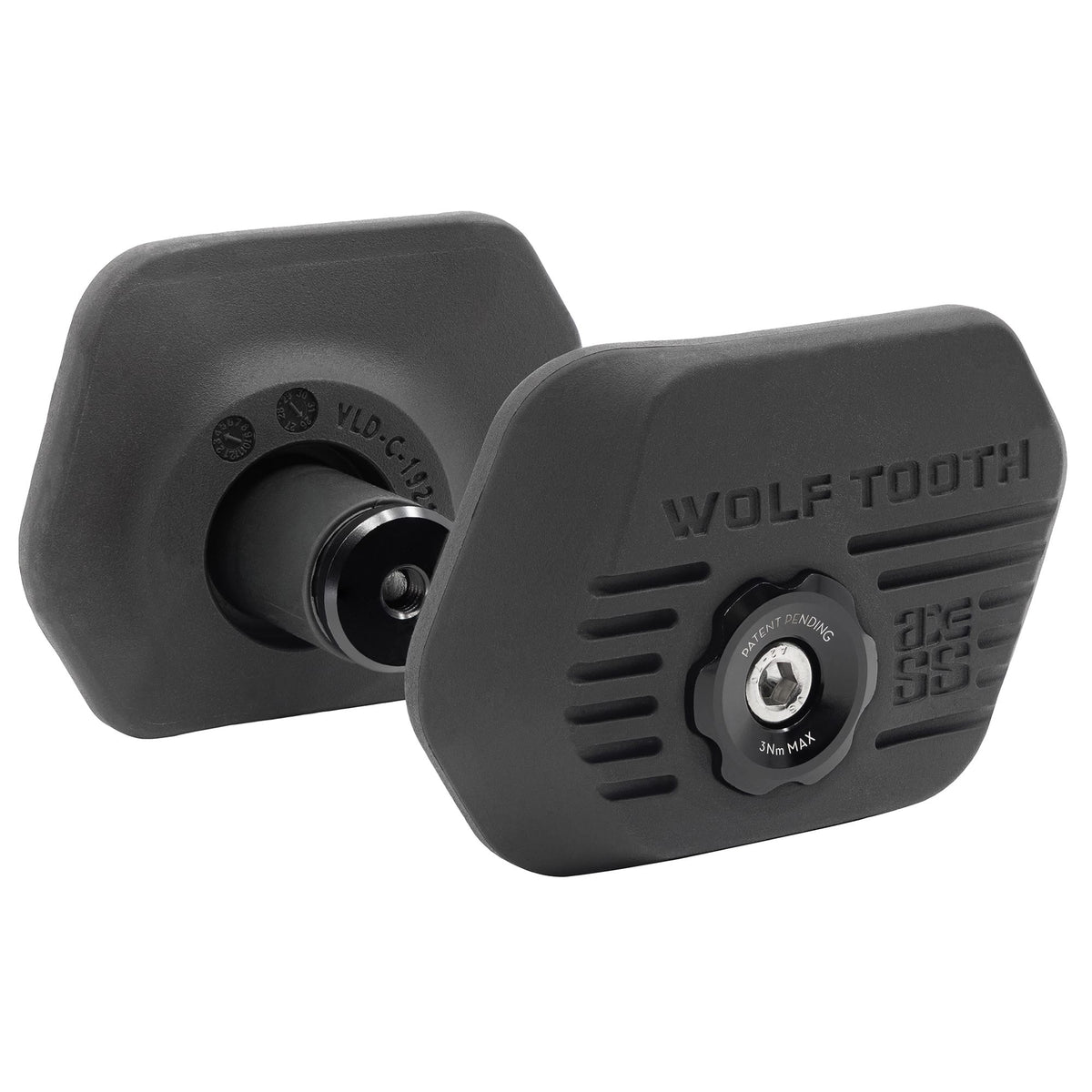 A pair of Wolf Tooth Locked-In bar ends, one showing the rubber outboard face and 3Nm torque marking, the other showing the lobed anti-rotation cap and internal wedge.